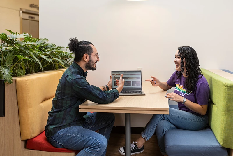 Kellanova Employees Collaborating at a Computer Mobile